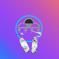 a pair of silver earrings on a purple background