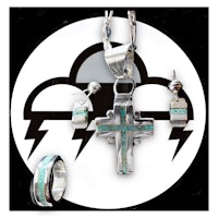a silver and turquoise jewelry set with a cross