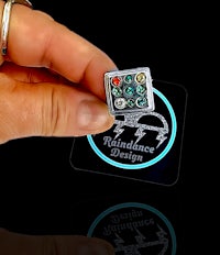 a person holding a ring with the word rhinestones on it